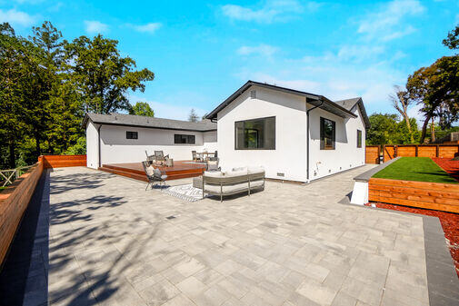 Spacious paver patio behind a completed ADU