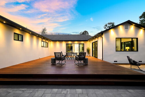 Backyard ADU with hardwood deck and courtyard lighting